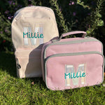Appliquéd initial backpack and lunch bag for nursery