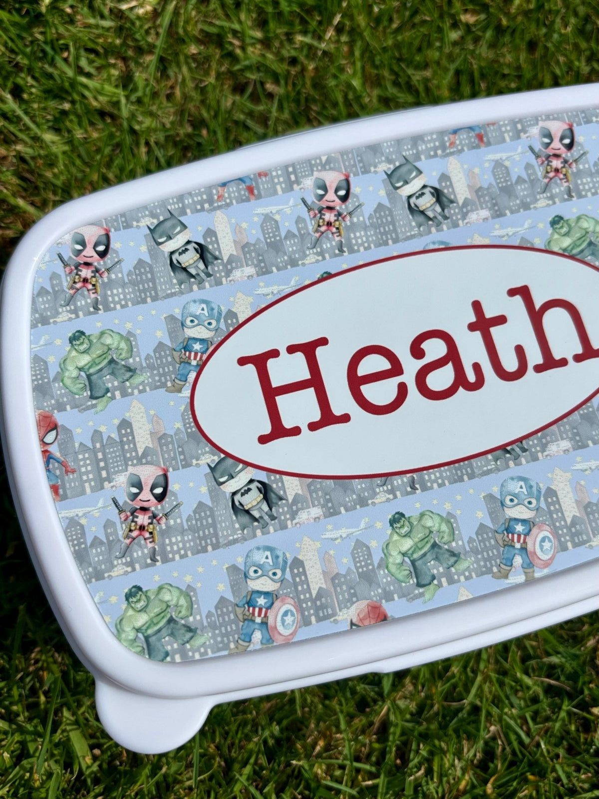 Personalised kids lunch box with superhero theme and name
